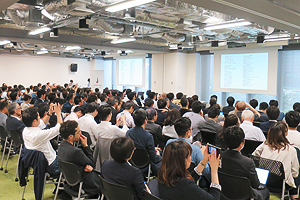 Photo of lively audience at announcement venue