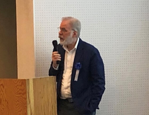 Photo of Dr. Geoffrey Ellis of the U.S. Geological Survey speaking on natural hydrogen potential in the U.S.